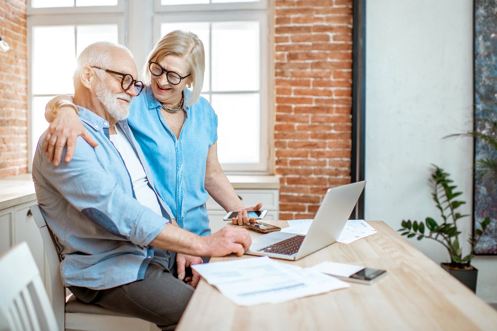 A senior couple looking at financial documents.