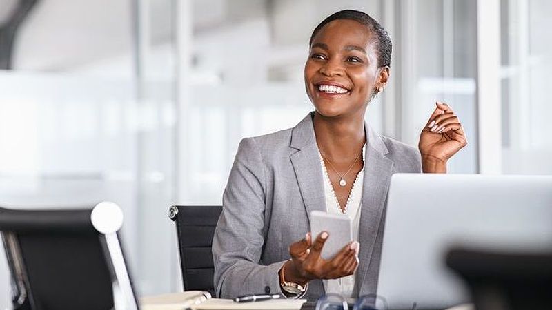 An investor checks on her portfolio on her smartphone.