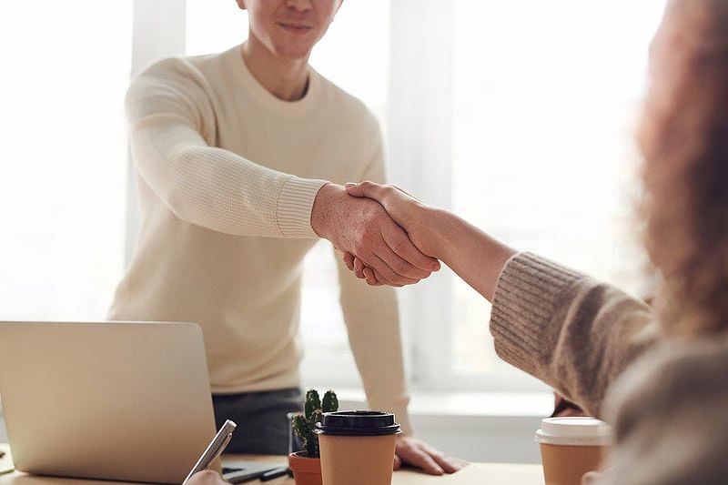 Two people closing a deal